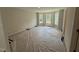 Unfurnished bedroom with new carpeting, neutral paint, lots of sunlight, and large windows at 83 W Emily Gardens Dr, Selma, NC 27576