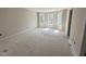 Bright bedroom with natural light from multiple windows creates a calming and inviting space at 83 W Emily Gardens Dr, Selma, NC 27576