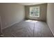 Cozy secondary bedroom with a large window offering ample natural light at 83 W Emily Gardens Dr, Selma, NC 27576