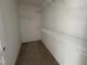 Walk-in closet with built-in shelving for optimal storage, ready for personalization at 83 W Emily Gardens Dr, Selma, NC 27576