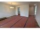 An open dining room offers a stylish lighting fixture, neutral walls, and laminate flooring at 83 W Emily Gardens Dr, Selma, NC 27576
