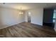 Bright dining room with wood flooring, modern chandelier, and neutral wall color at 83 W Emily Gardens Dr, Selma, NC 27576