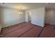Unfurnished dining area with new flooring, a modern chandelier, and freshly painted light gray walls at 83 W Emily Gardens Dr, Selma, NC 27576