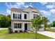 Beautiful two-story home with a well-maintained lawn and lush landscaping at 83 W Emily Gardens Dr, Selma, NC 27576