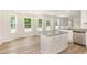 Eat-in kitchen featuring a breakfast nook, stainless steel dishwasher and island with granite countertops at 83 W Emily Gardens Dr, Selma, NC 27576
