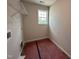 Small laundry room with a window for natural light and ready for appliance hookups at 83 W Emily Gardens Dr, Selma, NC 27576