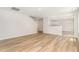 Open-concept living area with wood floors, seamlessly connecting to other living spaces at 83 W Emily Gardens Dr, Selma, NC 27576