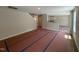 Spacious unfurnished living area with open floor plan, view of stairs, and access to the kitchen at 83 W Emily Gardens Dr, Selma, NC 27576