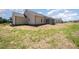 Expansive backyard with a screened-in porch perfect for outdoor entertaining and enjoying peaceful views at 87 Tee Dr, Selma, NC 27576