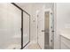 Modern bathroom with a glass-enclosed shower and neutral tile at 87 Tee Dr, Selma, NC 27576