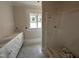 Unfinished bathroom features a new vanity and shower, awaiting final touches at 87 Tee Dr, Selma, NC 27576