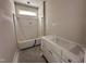 Unfinished bathroom features a tub with shower and new vanity awaiting final touches at 87 Tee Dr, Selma, NC 27576