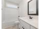 This bathroom has a large countertop, toilet, and a shower-tub combination at 87 Tee Dr, Selma, NC 27576