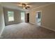A spacious bedroom with carpet, natural light, and an ensuite bathroom at 87 Tee Dr, Selma, NC 27576