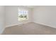 Bedroom featuring carpet, neutral walls, and window with a view at 87 Tee Dr, Selma, NC 27576
