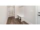 Inviting entryway with built-in bench and wood-look flooring at 87 Tee Dr, Selma, NC 27576