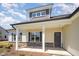 Inviting front porch with stone accents, white columns, and Craftsman-style details at 87 Tee Dr, Selma, NC 27576