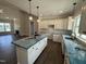 Modern kitchen with white cabinets, an island with pendant lighting, and an open layout at 87 Tee Dr, Selma, NC 27576