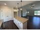 Kitchen island with granite countertops and white cabinets offering extra storage and style at 87 Tee Dr, Selma, NC 27576