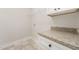 Functional laundry room with granite countertops and a wire rack for storage at 87 Tee Dr, Selma, NC 27576