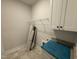 The laundry room features granite countertops and ample storage space at 87 Tee Dr, Selma, NC 27576