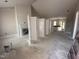 Spacious living room featuring a fireplace with white shiplap and open layout at 87 Tee Dr, Selma, NC 27576