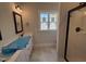 Main bathroom features double sinks, a walk-in shower, and tile flooring at 87 Tee Dr, Selma, NC 27576