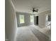 An unfinished main bedroom with an en-suite bathroom and a ceiling fan at 87 Tee Dr, Selma, NC 27576