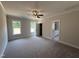 Spacious main bedroom with carpet, ceiling fan, and ensuite bathroom at 87 Tee Dr, Selma, NC 27576