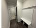 Mud room with built-in bench seating and coat hooks, perfect for organization at 87 Tee Dr, Selma, NC 27576