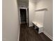 Mudroom with bench seating and coat hooks, creating a convenient and organized entryway into the home at 87 Tee Dr, Selma, NC 27576