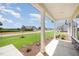 Covered porch offering scenic neighborhood views and a relaxing outdoor space at 87 Tee Dr, Selma, NC 27576