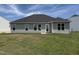 Well-maintained backyard featuring a patio and expansive lawn, perfect for outdoor gatherings at 89 W Emily Gardens Dr, Selma, NC 27576