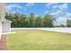 Spacious backyard surrounded by a privacy fence and lush green trees, perfect for outdoor activities at 89 W Emily Gardens Dr, Selma, NC 27576