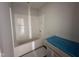 This bathroom features a tub and a new vanity with a blue countertop protector on top at 89 W Emily Gardens Dr, Selma, NC 27576