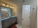 Bathroom featuring double sink vanity with modern fixtures, and a private toilet and shower room at 89 W Emily Gardens Dr, Selma, NC 27576