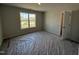 Bright bedroom with a large window and carpet floors, providing a view and comfort at 89 W Emily Gardens Dr, Selma, NC 27576