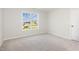 Comfortable bedroom with a bright window for natural light and soft carpeting at 89 W Emily Gardens Dr, Selma, NC 27576