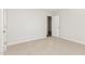 Neutral bedroom with a doorway leading to another room and soft carpeting at 89 W Emily Gardens Dr, Selma, NC 27576