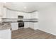 Kitchen features stainless steel appliances, granite countertops, and white cabinetry at 89 W Emily Gardens Dr, Selma, NC 27576