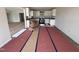 Eat-in kitchen with all white cabinets, granite countertops, and stainless steel appliances at 89 W Emily Gardens Dr, Selma, NC 27576