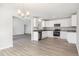 Open kitchen with stainless steel appliances and white cabinets and countertops at 89 W Emily Gardens Dr, Selma, NC 27576