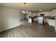 Open-concept kitchen with modern appliances, stainless steel dishwasher, and plenty of countertop space at 89 W Emily Gardens Dr, Selma, NC 27576