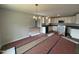Open-concept kitchen with white cabinets and new appliances, seamlessly connected to the dining area at 89 W Emily Gardens Dr, Selma, NC 27576