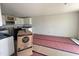 Eat-in kitchen with all white cabinets, granite countertops, and stainless steel appliances at 89 W Emily Gardens Dr, Selma, NC 27576