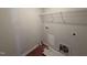 Unfinished laundry room offering practical space for laundry appliances with wire shelving for storage at 89 W Emily Gardens Dr, Selma, NC 27576