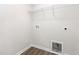 A utility room or closet with hookups for a washer and dryer and a shelf for storage at 89 W Emily Gardens Dr, Selma, NC 27576