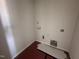 The laundry room features hookups, ready for a washer and dryer at 89 W Emily Gardens Dr, Selma, NC 27576