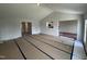 Spacious living room featuring an open floor plan with a view into the kitchen at 89 W Emily Gardens Dr, Selma, NC 27576