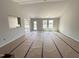 Spacious living room featuring white walls, lots of windows and great natural light at 89 W Emily Gardens Dr, Selma, NC 27576